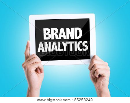 Tablet pc with text Brand Analytics with blue background