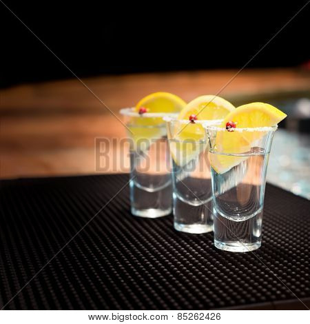 Three Tequila Shots With Lemon