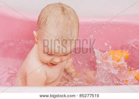 baby bathes in a bathroom