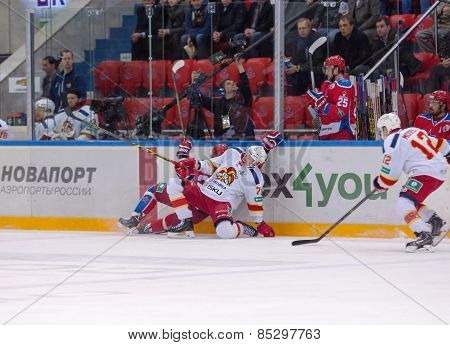 E. Sallinen (76) And A. Stas (23) Fall Down