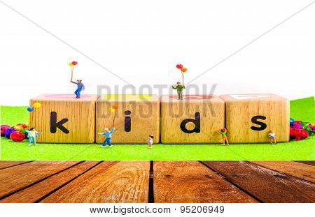 Image Of Mini Figure Kids Dolls Hold Balloon Playing On Toys Wooden  Blocks .