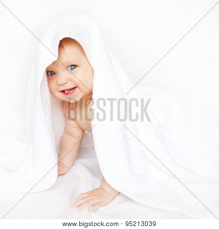 Baby Under The Towel Showing Tongue.