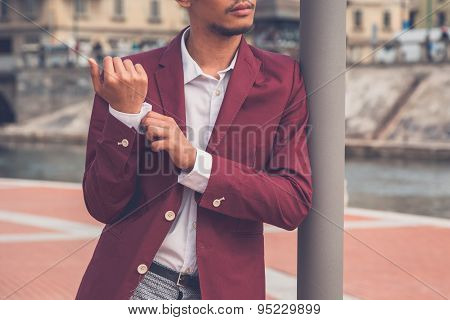 Handsome Asian Model Posing By An Artificial Basin