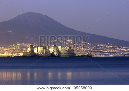 Castel Dell'ovo With Mount Vesuvius In The Background In Naples