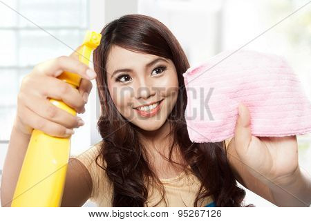 Beautiful Young Asian Woman Doing Chores, Holding Sprayer And Pi