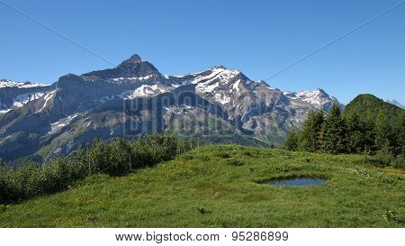 Snow Covered Mountains And Pond