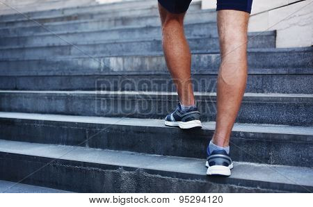 Sport, Fitness And Healthy Lifestyle Concept - Man Running In The City, Feet Of Male Runner On Steps