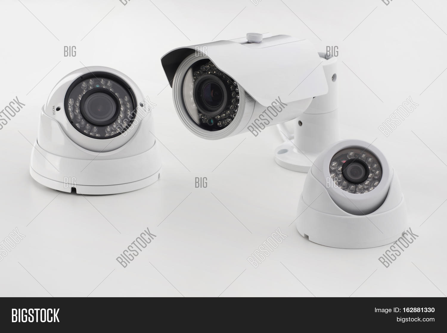 Bullet style and dome secure camera on light background, surveillance camer...