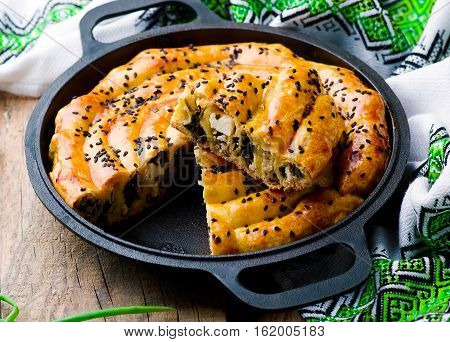 Vertuta - spinach feta spiral traditional Moldavian pie. style rustic. selective focus