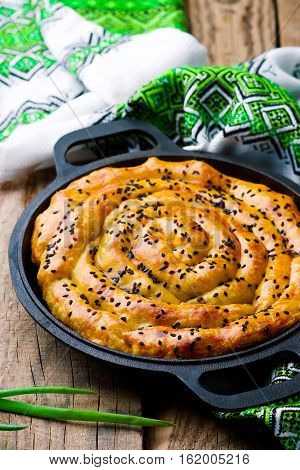 Vertuta - spinach feta spiral traditional Moldavian pie. style rustic. selective focus