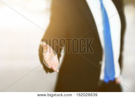 business man with an open hand ready to seal a deal