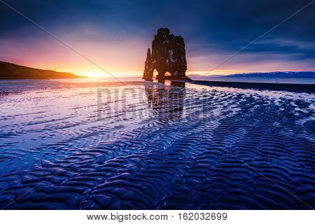 Spectacular dark sand after the tide. Picturesque and gorgeous scene. Location famous place Hvitserkur rock, Vatnsnes peninsula, northwest Iceland, Europe. Popular tourist attraction. Beauty world.
