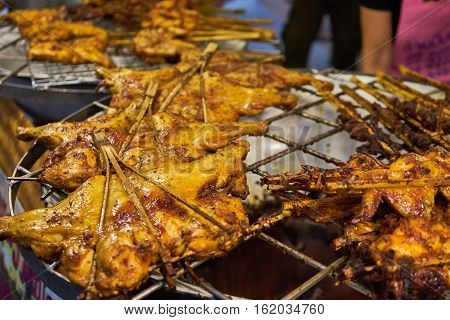 this image is about grilled chicken in thailand