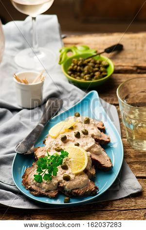Vitello tonnato . selective focus. style rustic