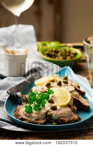 Vitello tonnato . selective focus. style rustic