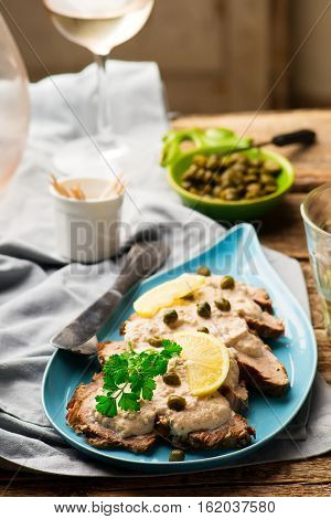 Vitello tonnato . selective focus. style rustic
