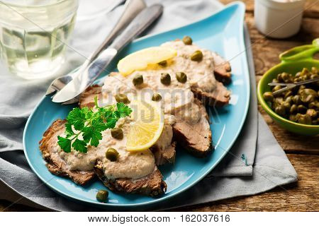 Vitello tonnato . selective focus. style rustic