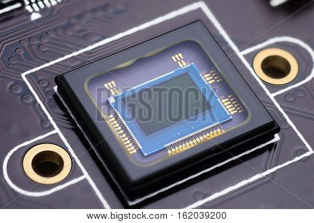 Security camera censor chip on electronic circuit board. Macro shot