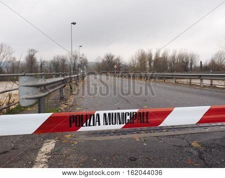 Local Police line (Polizia Municipale in Italian) do not cross. Bridge access blocked for flood risk