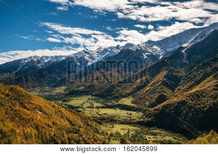 Valley of Enguri river with small georgian villages at oot of mountains of Svaneti Range in Upper Svaneti Georgia
