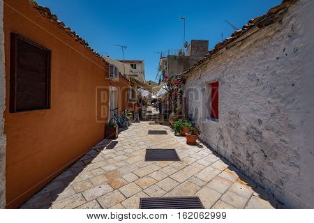 The Island of Paxos, Greece, 22 May, 2016: Short summer walk along the narrow streets of the Island of Paxos.