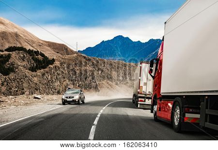 military road in Georgia with truks queue