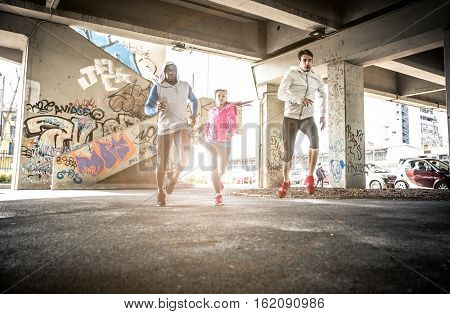 Urban runners training in the city and having fun