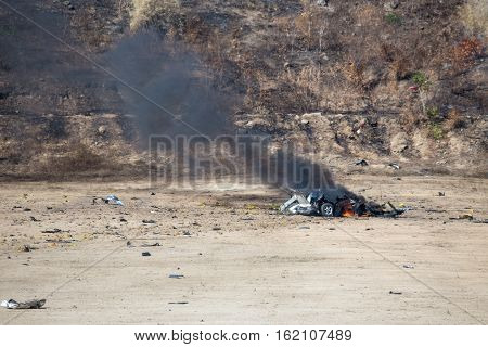 fire and movement of car part blown away from explosion in post blast investigation course training