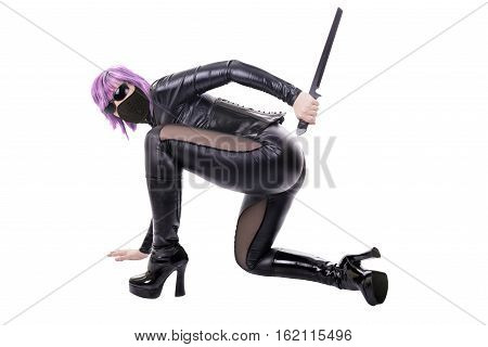 Sexy woman holding blade ready to fight. Isolated on white background.