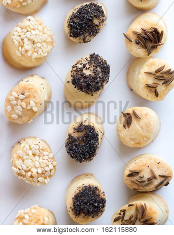 Different salty party snacks in s row.