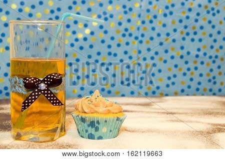 cake and a glass of water on the wooden background