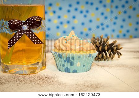 cake and a glass of water on the wooden background