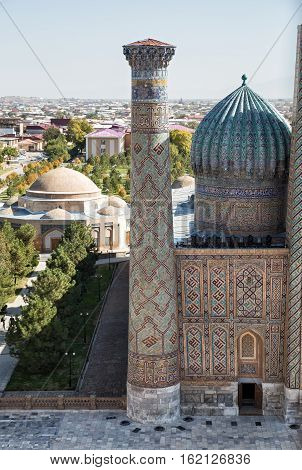 Samarkand. Top view of a minaret and the dome of Sher-Dor madrasah Registan