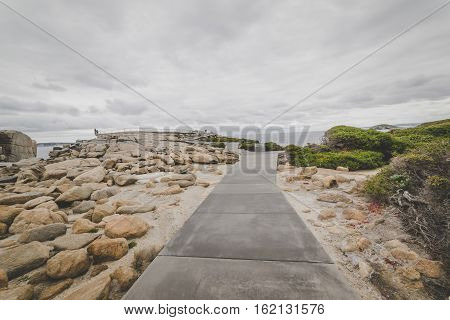 Footpath to the Gap a stone formation in Torndirrup National Park Albany Western Australia. vintage toning filter add .