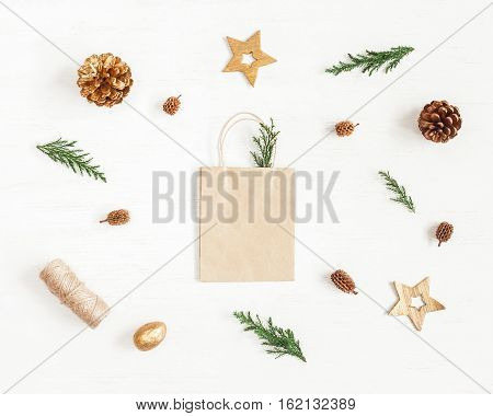 Christmas composition. Gift christmas decoration cypress branches pine cones. Flat lay top view