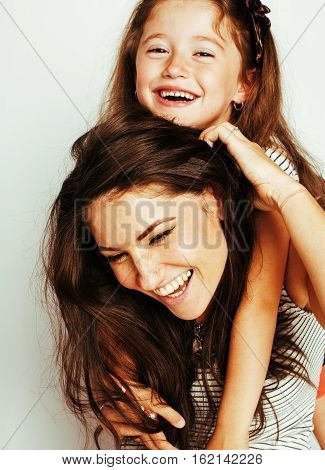 bright picture of hugging mother and daughter happy together, smiling stylish family. lifestyle people concept close up