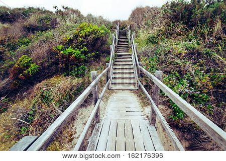 Steps leading down to beach at Torndirrup National Park Albany Western Australia Australia.vintage toning filter add .