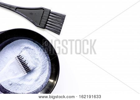 Tools for hair dye and hairdye top view on white background