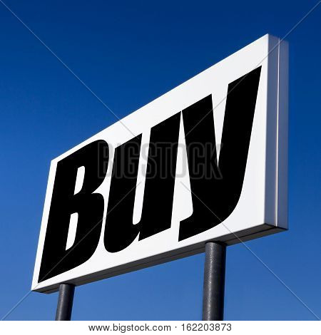 Horizontal billboard with the order to BUY against real blue sky. Abstract concept of consumerism human mind control power of corporations and lobbies.