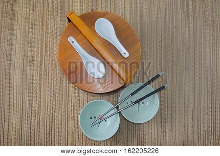 Chinese lunch box on the background bamboo mat top view
