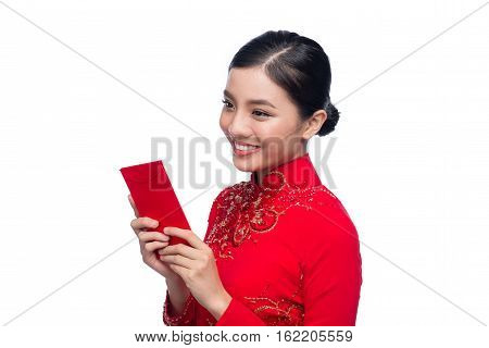 Portrait Of A Beautiful Asian Woman On Traditional Festival Costume Ao Dai Holding Red Pocket - Luck