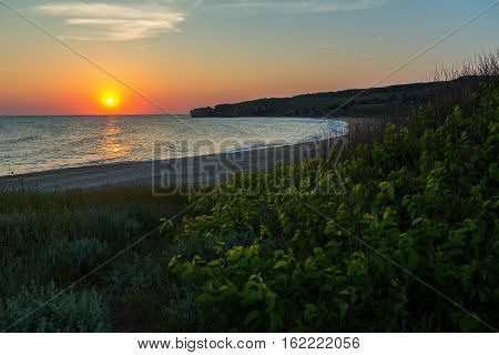 Sun rises over the Sea of Azov on Generals beach. Karalar regional landscape park in the Crimea.