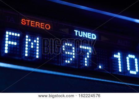 FM tuner radio display. Stereo digital frequency station tuned. Horizontal