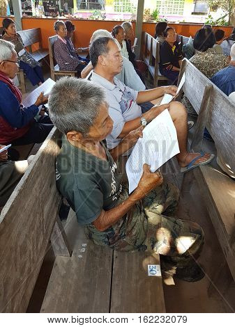 CHIANG RAI THAILAND - DECEMBER 19 : Unidentified asian old people suffering from leprosy reading and waiting for treatment on December 19 2016 in Chiang rai Thailand.