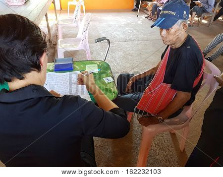 CHIANG RAI THAILAND - DECEMBER 19 : Unidentified female asian doctor diagnose old man suffering from leprosy on December 19 2016 in Chiang rai Thailand.