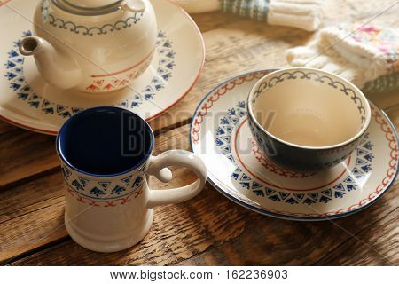Set of dinnerware on wooden table