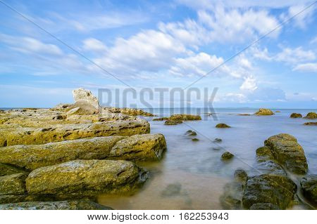 A view of beautiful Tanjung Kubong tropical beach with rocks formation located at the northern tip of Labuan Island. It is also the place where the famous and mysterious chimney standing high.