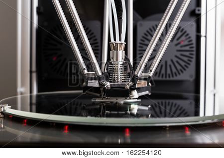3D printer in closeup printing an object