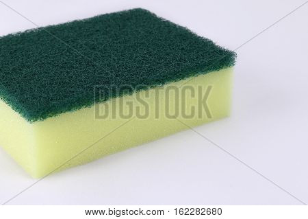 Scotch brite or dish washing sponge on white background.