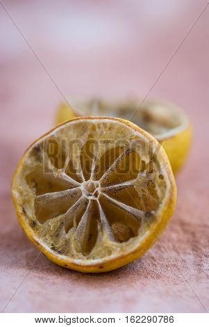 Molded lemon on a wooden background.Molded lemon Macro